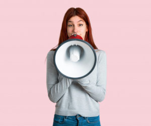 young redhead girl shouting through a megaphone to announce something on isolated pink background 1368 18022 300x250 - Facebook Ads: Como Ele Pode Alavancar Seus Negócios?